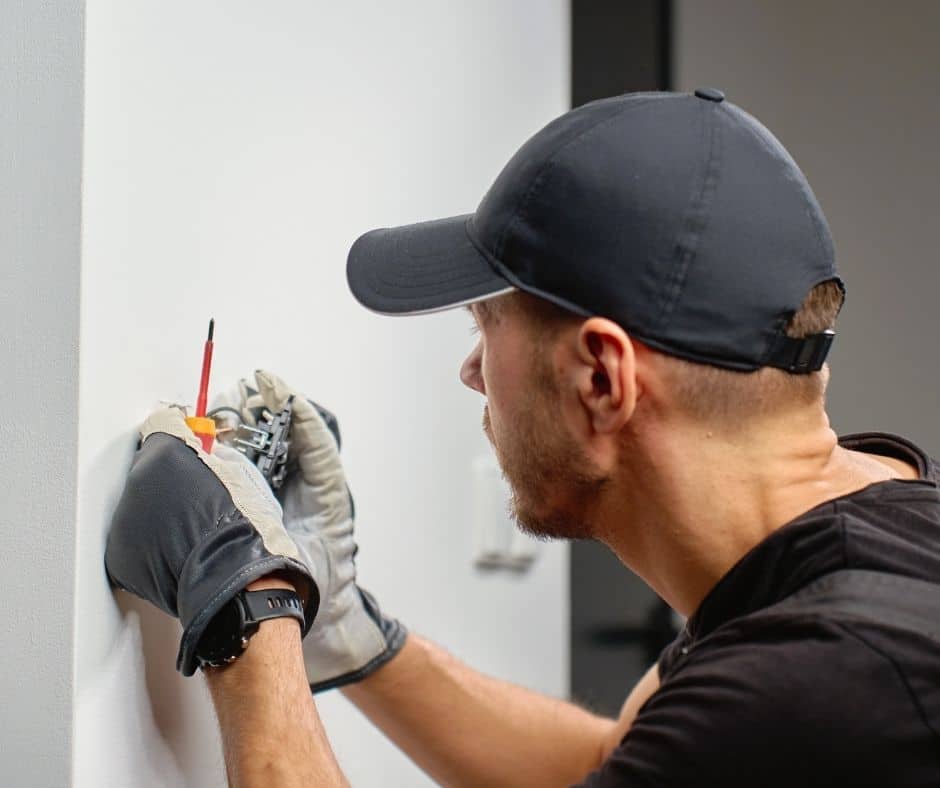 Electrician checking an outlet switch