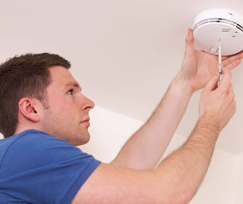 Electrician Installing Smoke Detector