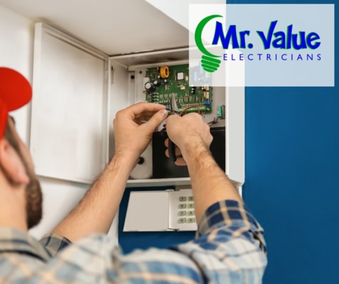Electrician installing Whole-home Surge Protection